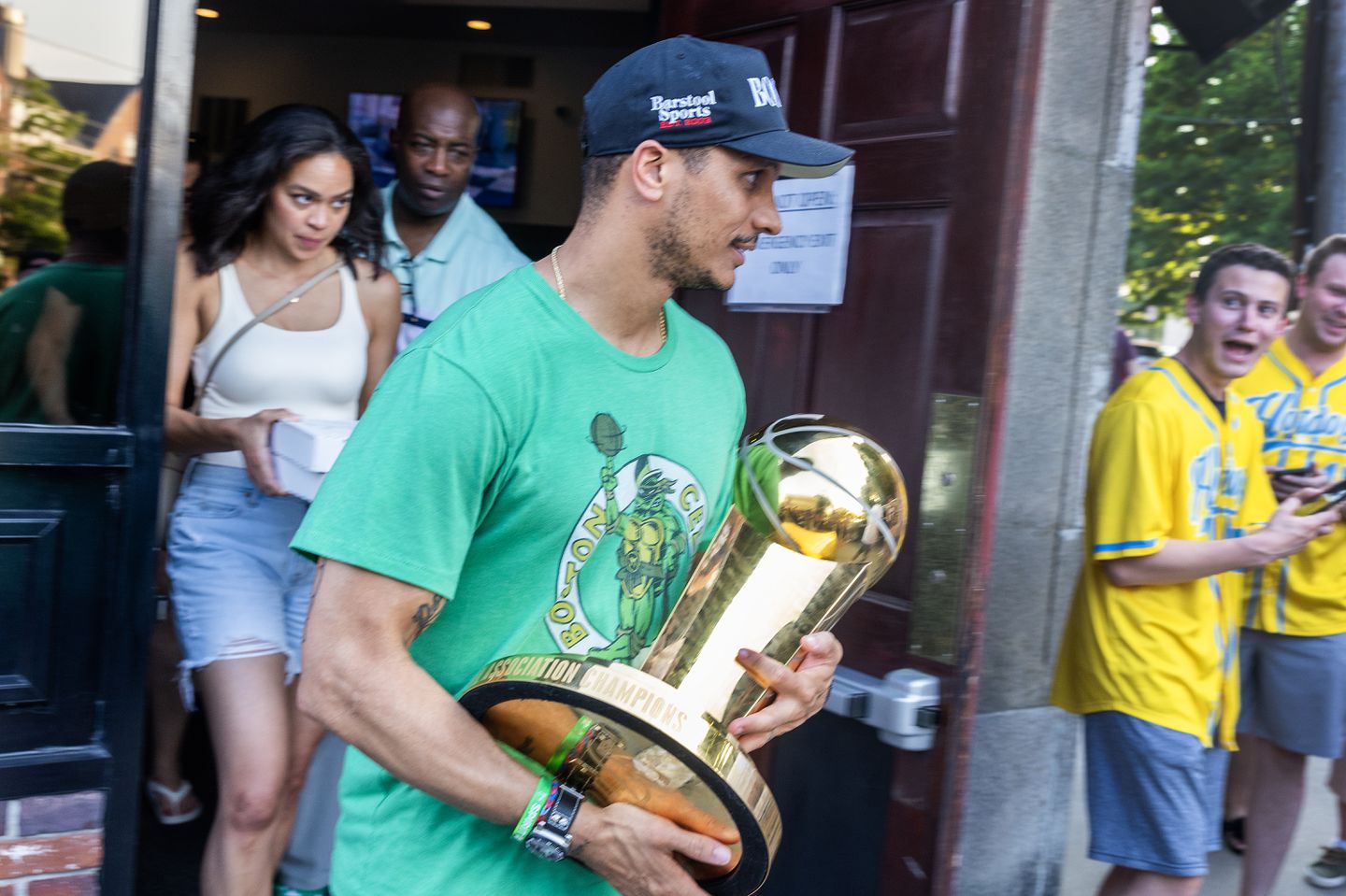 Fans gathered outside the Fowler House Cafe in Quincy to catch a glimpse at the Larry O'Brien trophy and Celtics coach Joe Mazzulla.